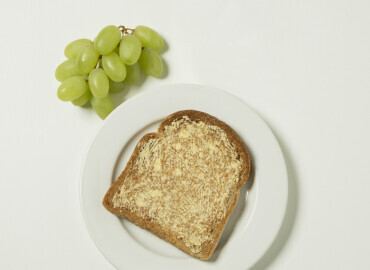 Grapes, slice of toast with lower fat spread