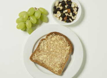Grapes, slice of toast with lower fat spread