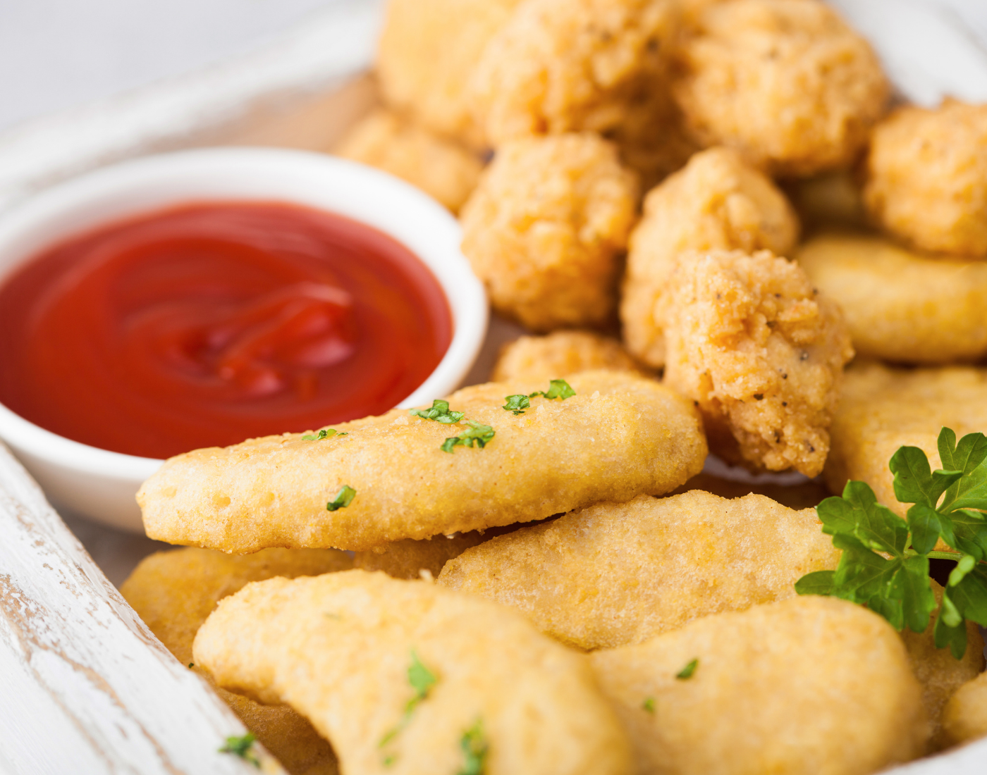 Battered chicken nuggets with ketchup