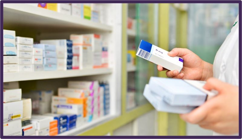 A pharmacist examining different types of medication
